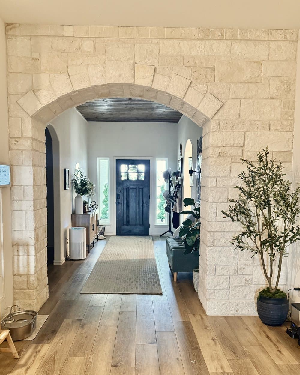 Limestone archway in a home entry hall
